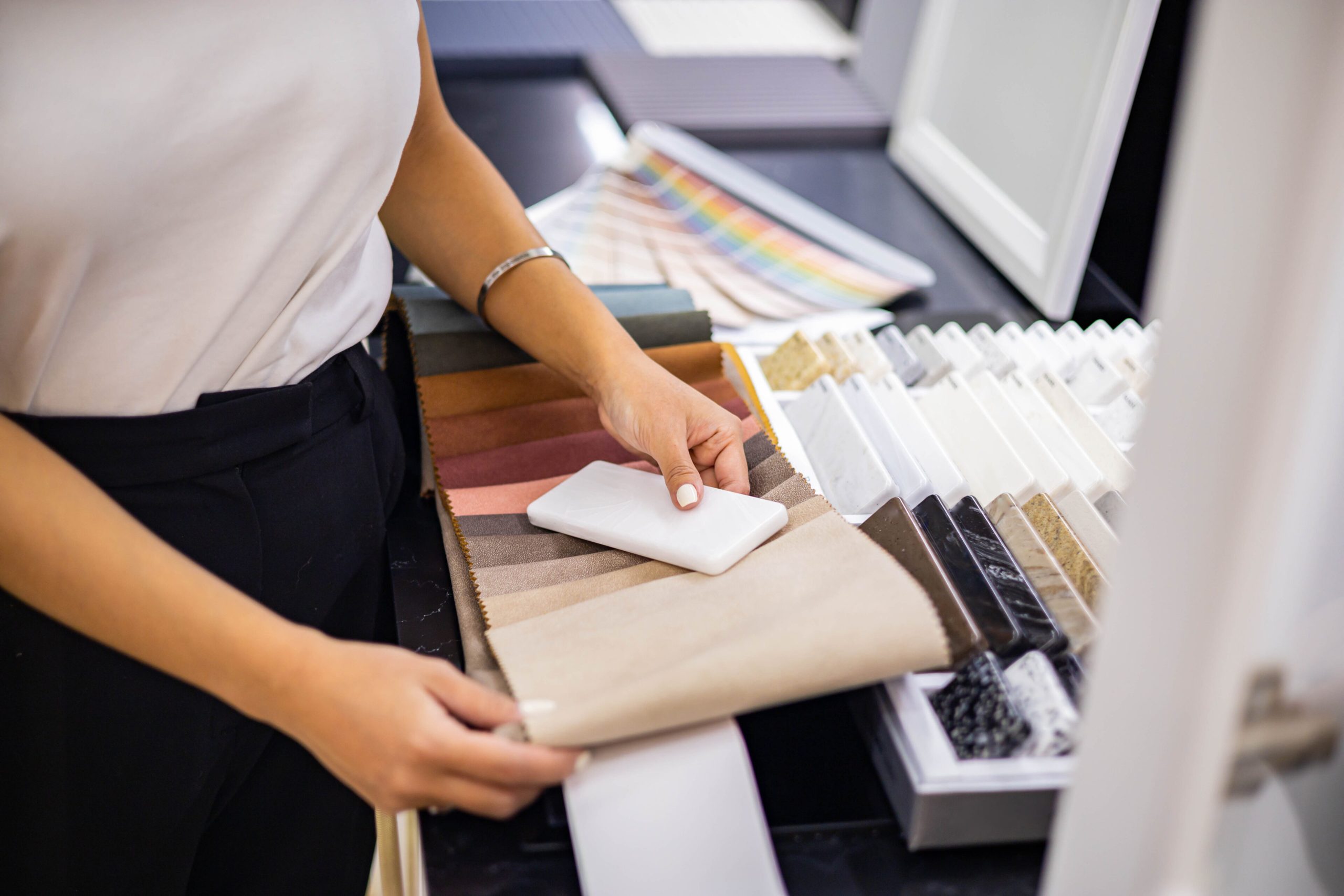 Female professional indoor decorator working at showroom or residential apartment